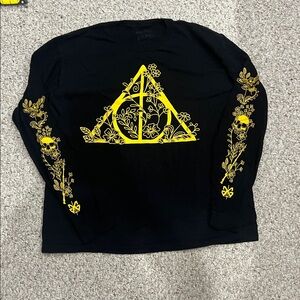 Black Long-Sleeve Graphic Top with Yellow Floral Emblem